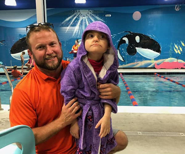 Maddie and Brian Farr at the pool